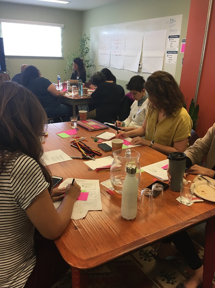 Cal Wellness grantees working at a table